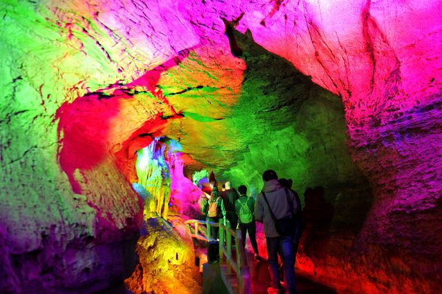 yishui, china   april 26, 2021   visitors look at colorful stalactites and stalagmites in the underground grand canyon in yishui county, shandong province, china, april 26, 2021 photo credit should read costfotobarcroft media via getty images
