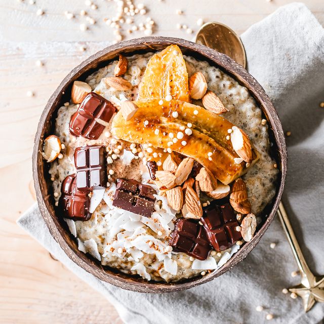 oatmeal bowl topped with caramelized banana, almonds and chocolate