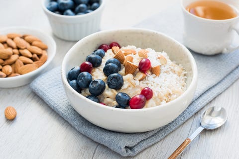 Oatmeal porridge bowl with blueberries, cranberries and almonds