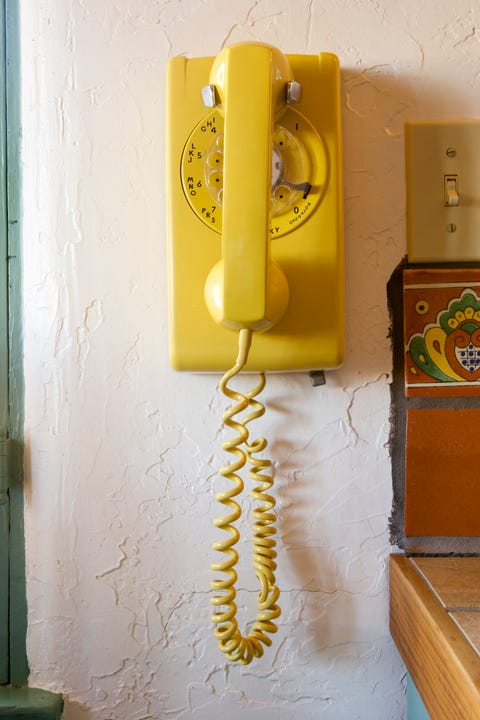 Old-fashioned yellow Rotary Telephone