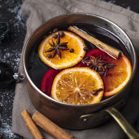 A pot full of oranges on low heat