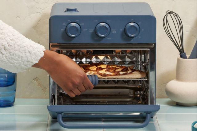 a person using an our place oven