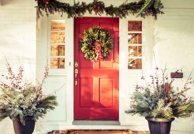 exterior red door decorated for christmas