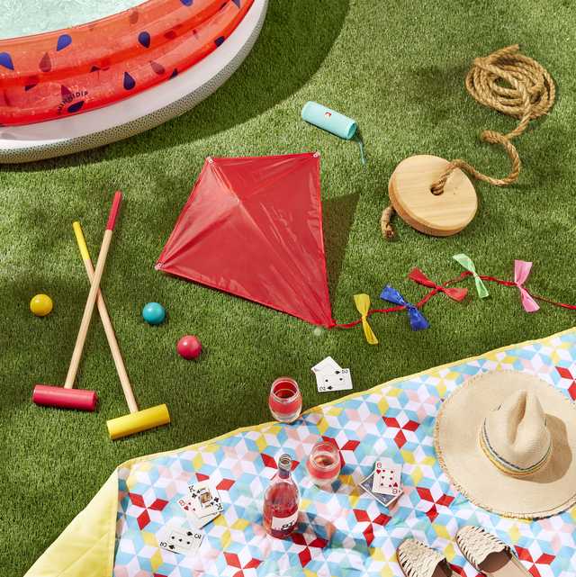 outdoor games and activities above ground pool, tree swing, kite, picnic quilt, lawn game