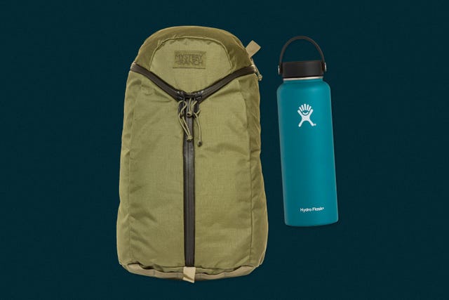 an olive green backpack next to a turquoise water bottle on a dark blue background
