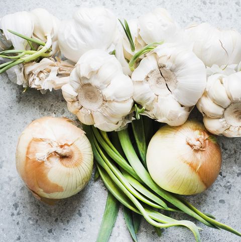 Overhead view of onions and garlic bulbs