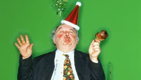 overweight man standing under mistletoe, pouting enhancement