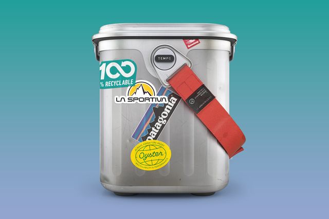 a silver oyster cooler with stickers on it