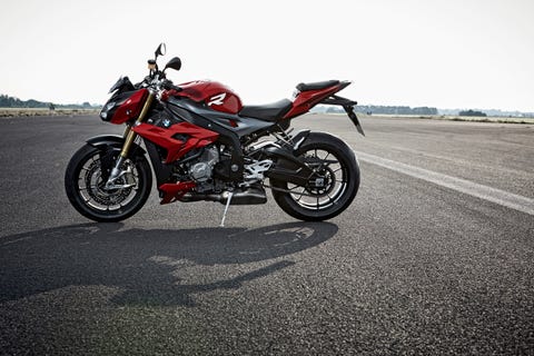 bmw s 1000 r motorcycle parked on an airplane tarmac
