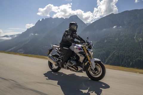 bmw r 1250 r roadster riding with mountains in the background