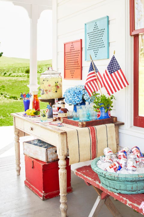 fourth of july cookout picnic in front of white farmhouse  beverages