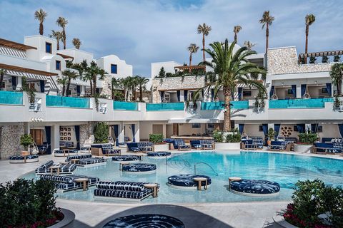 Resort, Swimming pool, Building, Property, Town, Hotel, Vacation, Real estate, Mixed-use, Palm tree, 