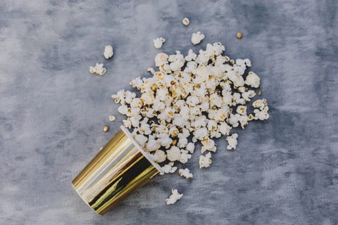 pop corn  in golden vase.Grey background