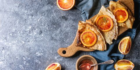 Pancakes with bloody oranges