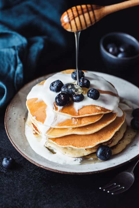 Pancakes with honey, blueberries