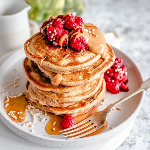 pancakes with raspberries, peanut butter and syrup