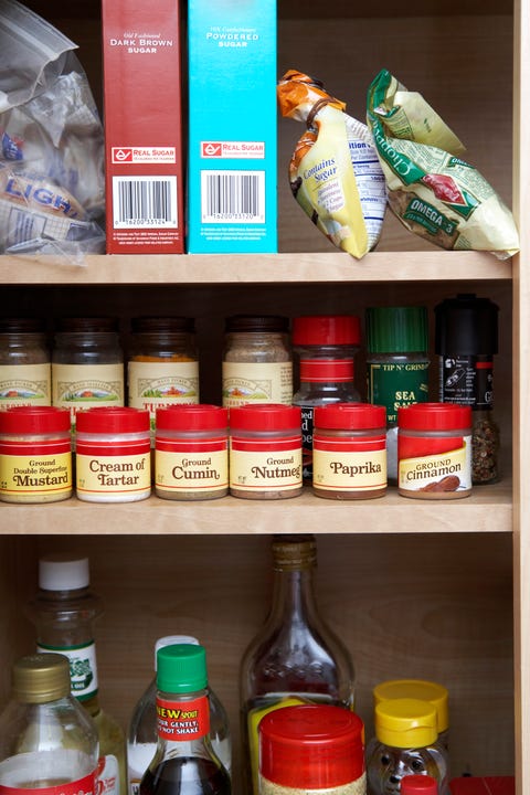 Pantry Cabinet Stocked with Spices and Condiments