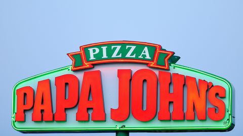 Illuminated Papa John's Pizza Sign at Sunset