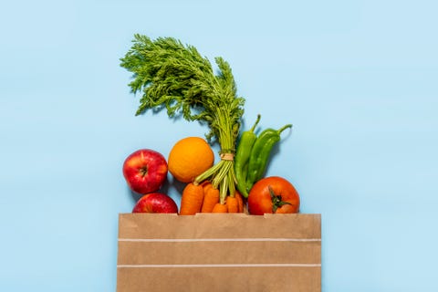 paper bag full of fruits and vegetables