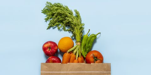 paper bag full of fruits and vegetables