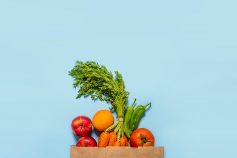 paper bag full of fruits and vegetables