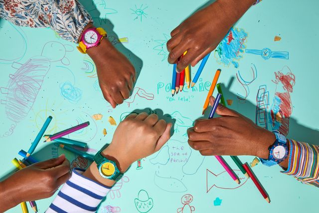 kids coloring with parchie watches on wrists
