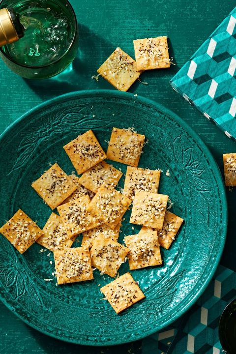 parmesan seeded crackers on a blue plate