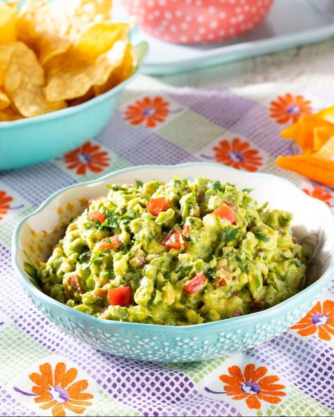 best ever guacamole with chips and veggies in background