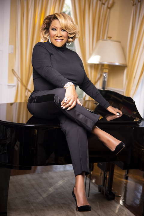 patti labelle sitting on a grand piano