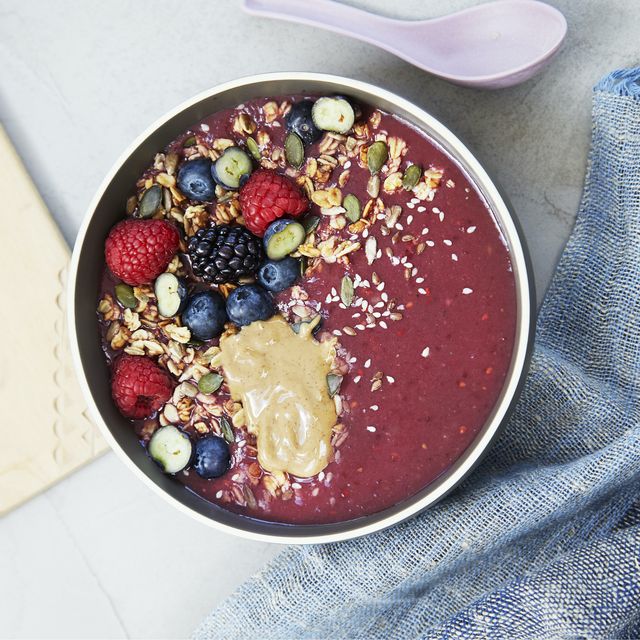 what to eat for a pcos diet a berry smoothie bowl with fruit, seeds and nut butter