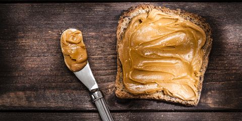 peanut butter on toast shot on rustic wooden table