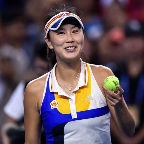 peng holding a tennis ball