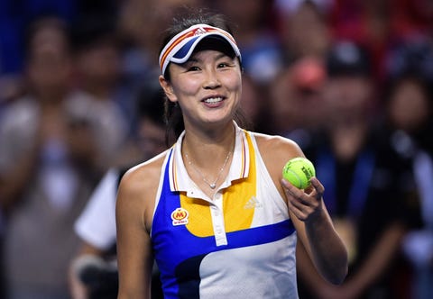 peng holding a tennis ball
