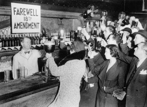 People of New York are celebrating the end of the Prohibition with beer. Photograpg. 1933.