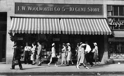 People walk past Woolworth Store