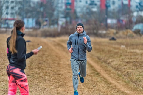 Personal trainer with stopwatch