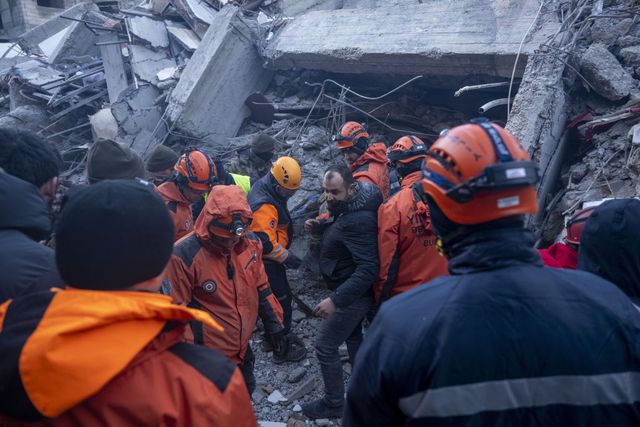 excavator operator helps teams to rescue his family under rubble after quakes hit southern turkiye