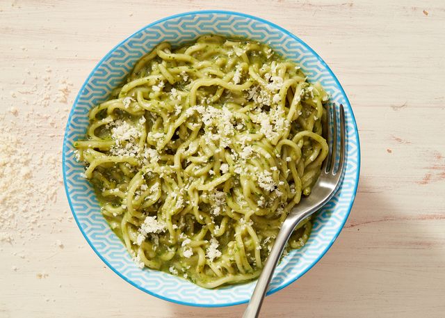 creamy green pesto ramen topped with a sprinkling of parmesan cheese