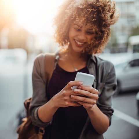 Photo of a woman using smart phone