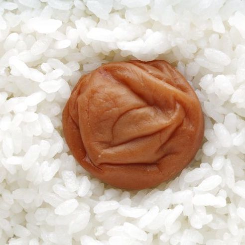 A pickled plum in white rice