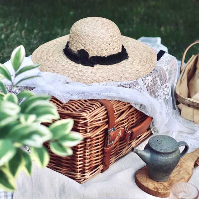 picnic with bread and tea in summer garden