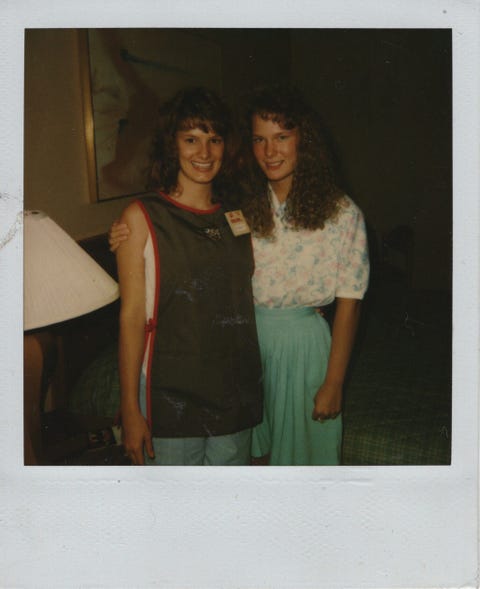 kin author shawna kay rodenberg pictured in a piggly wiggly supermarket smock alongside her sister