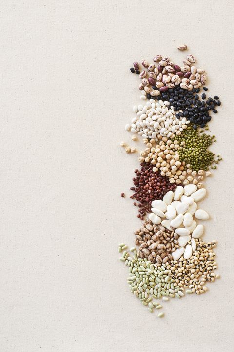 Piles of Dried Beans and Legumes, studio shot on beige background