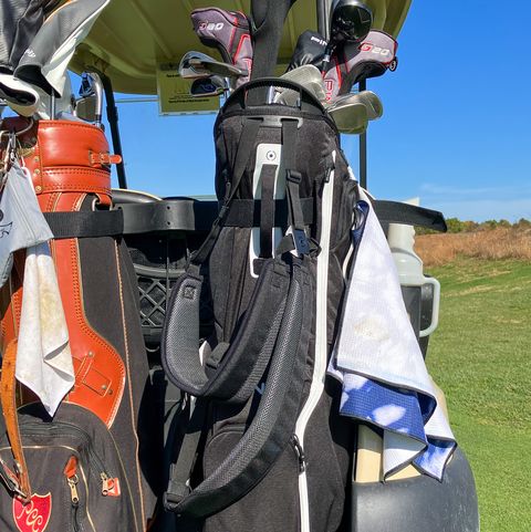 two golf bags on the back of a golf cart