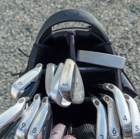 golf clubs in a ping hoofer stand golf bag