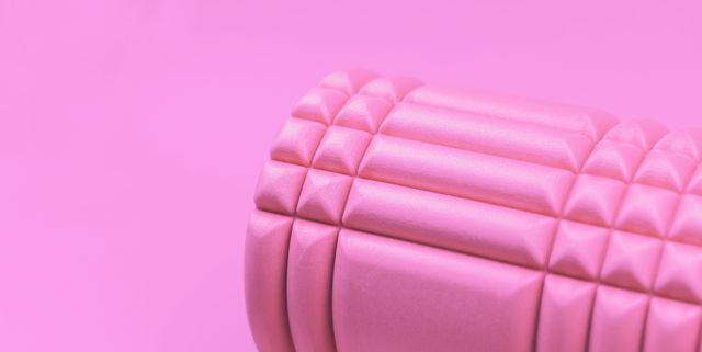 pink foam roller on pink background