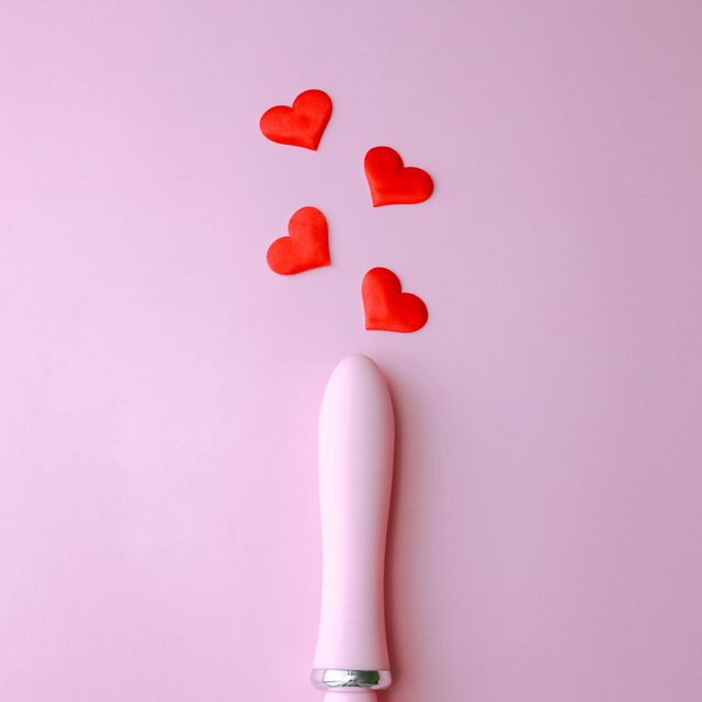 pink sex toy vibrator for women over pink background