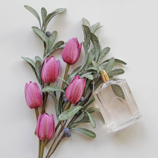 pink tulips bouquet and perfume bottle