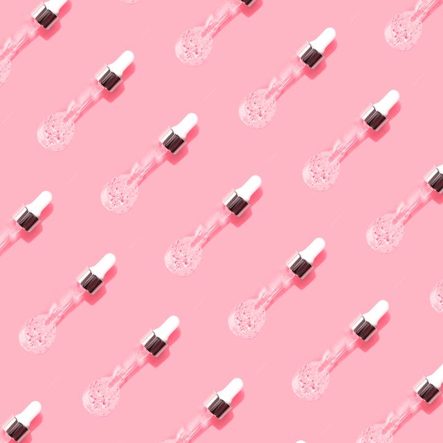 pipette with fluid hyaluronic acid on pastel pink background