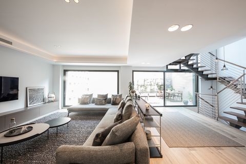 salón de diseño minimalista decorado en grises